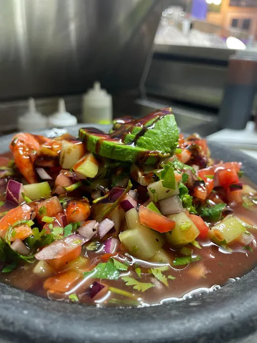 La cruda mariscos y clamat. Picture 1