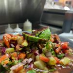 La cruda mariscos y clamat.